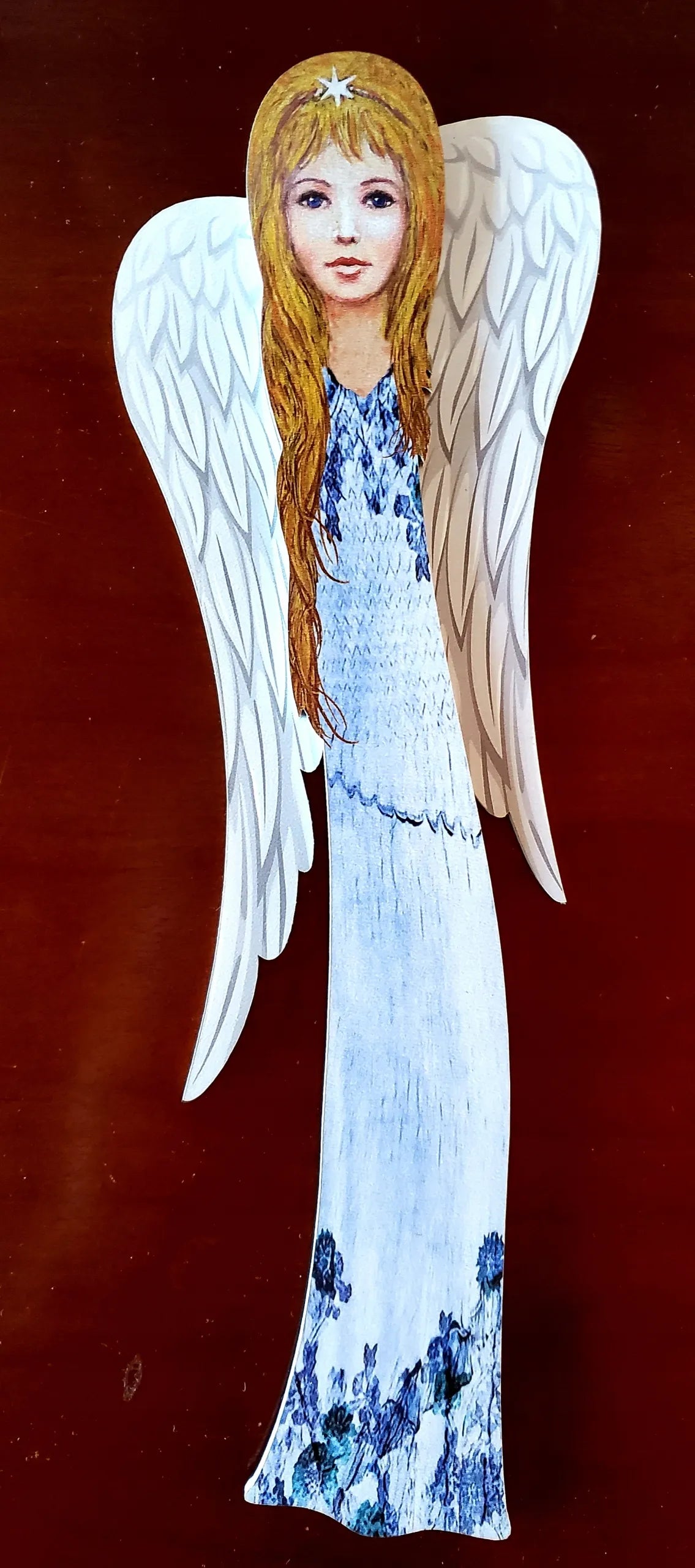Angelas, atspaudas ant medžio