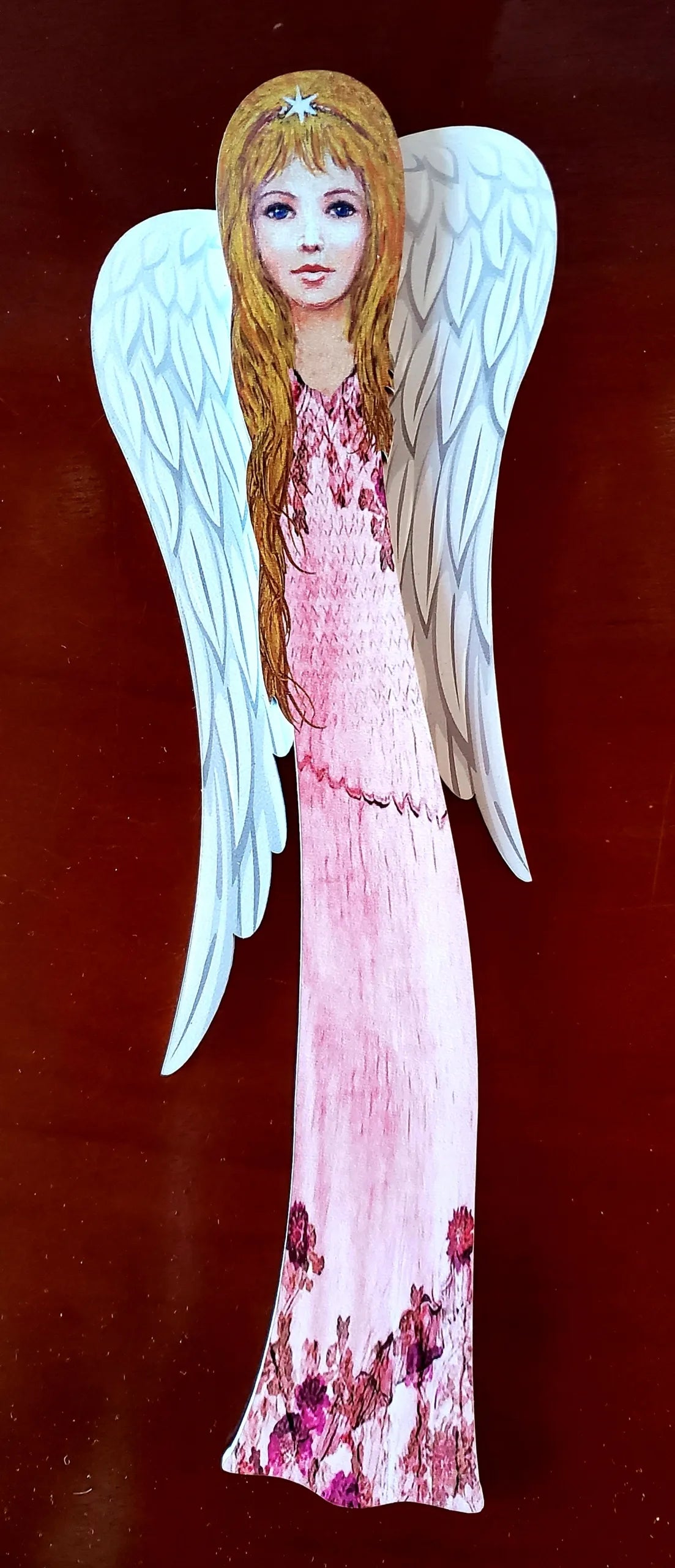 Angelas, atspaudas ant medžio